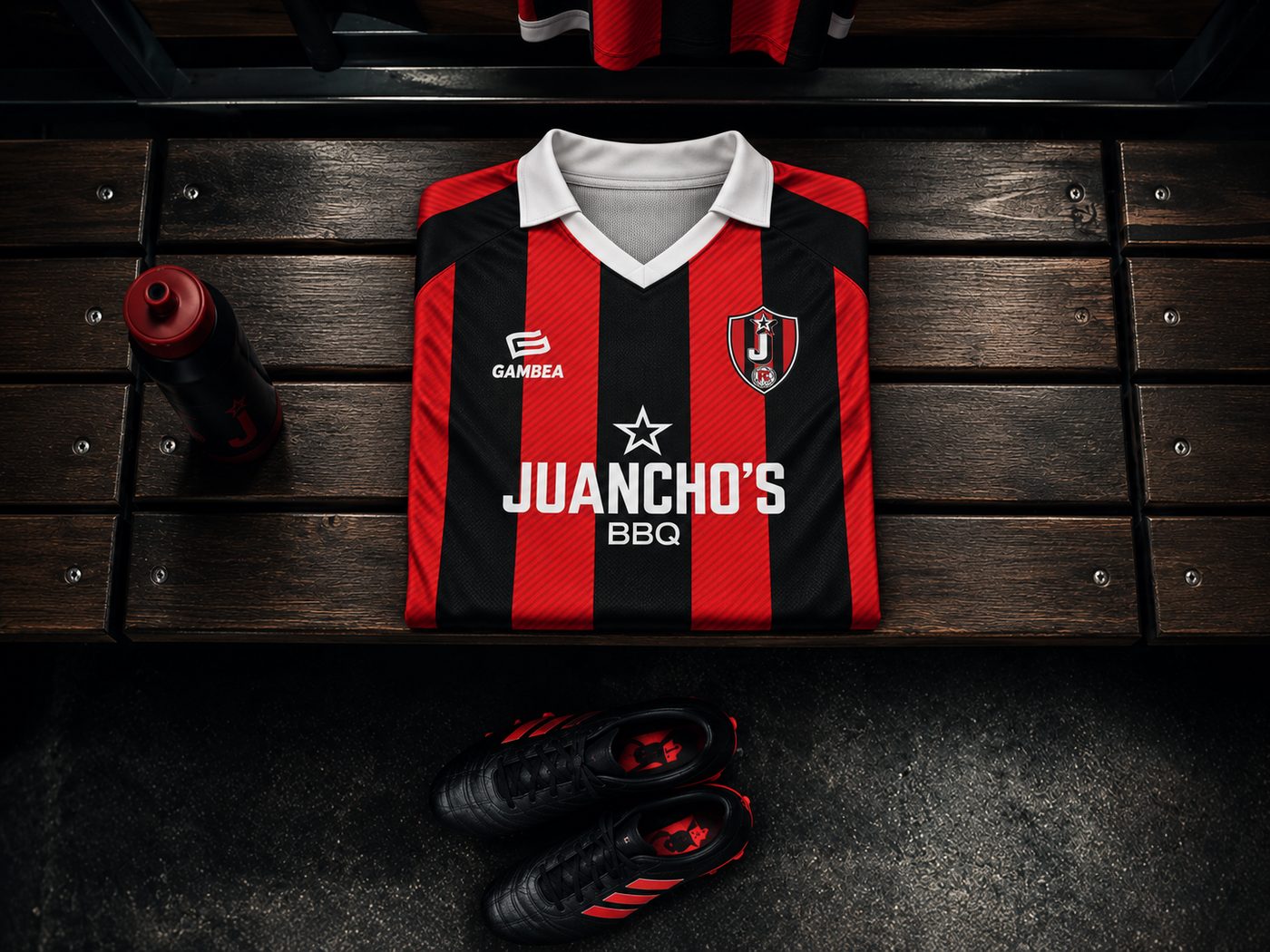 Camiseta oficial de Juanchonistas FC doblada en el banquillo del vestuario